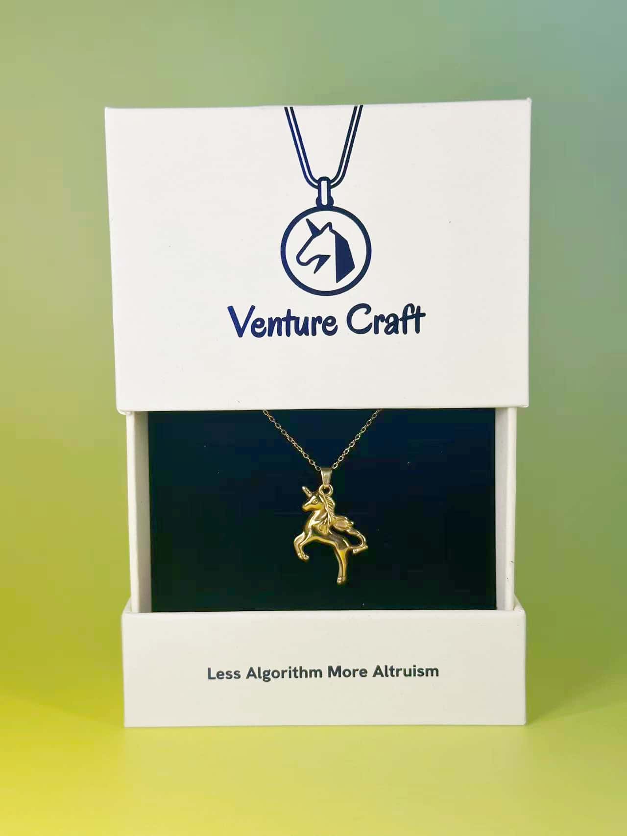 The gold unicorn necklace beautifully presented in the official Venture Craft gift box