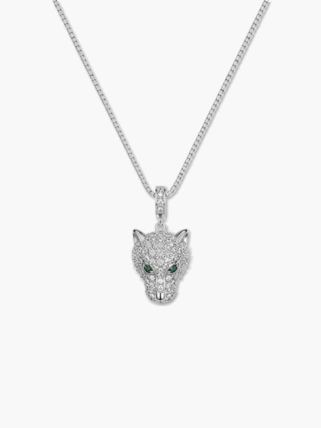 Venture Craft pave cubic zirconia leopard necklace with vivid emerald green eyes on a silver box chain, vertical studio shot against a crisp white background