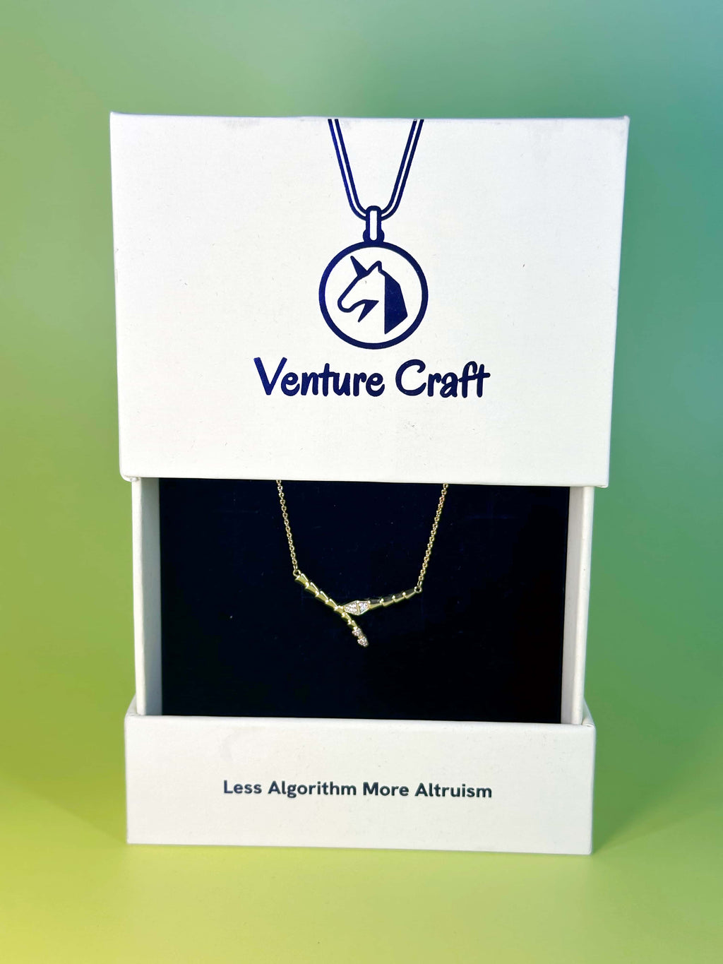 Luxury Venture Craft white gift box opening to reveal the delicate snake necklace nestled securely in a premium black velvet insert