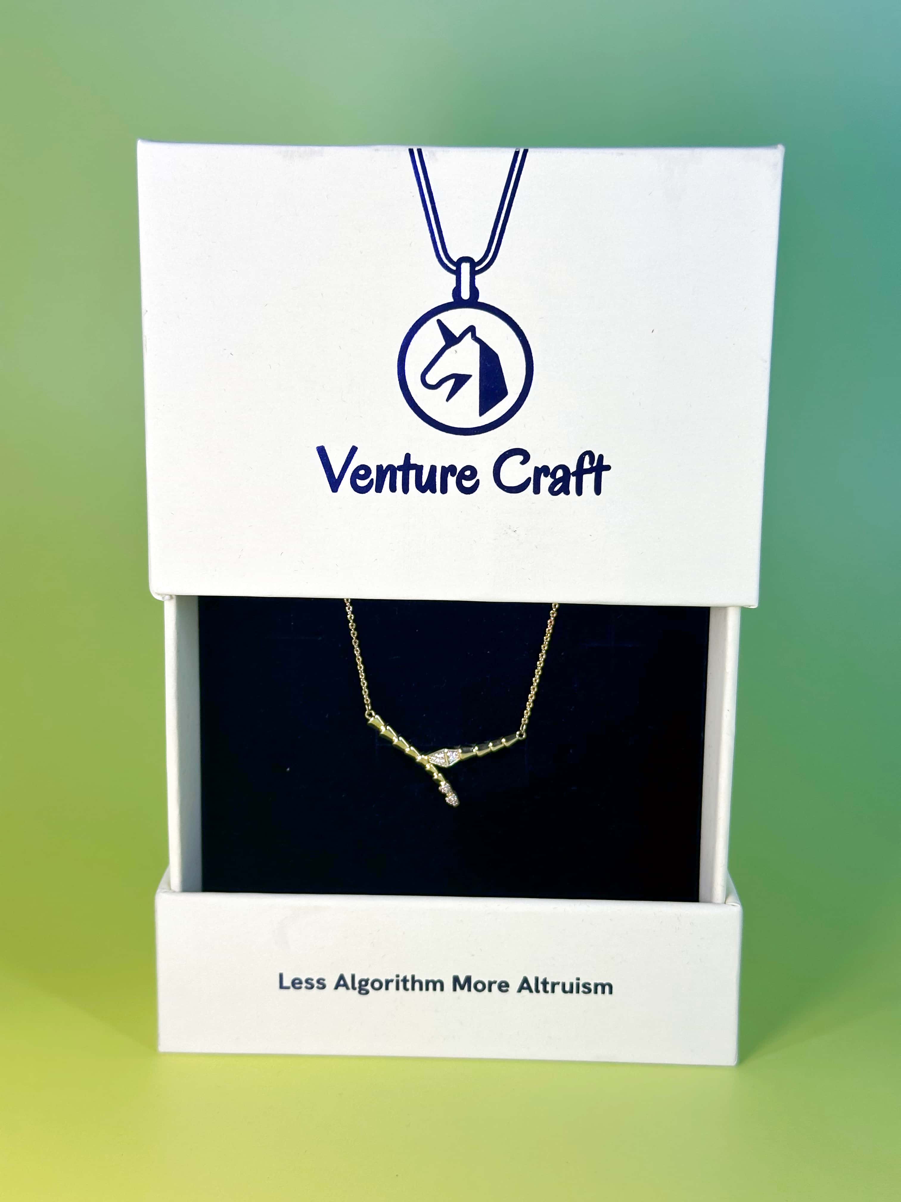 Luxury Venture Craft white gift box opening to reveal the delicate snake necklace nestled securely in a premium black velvet insert